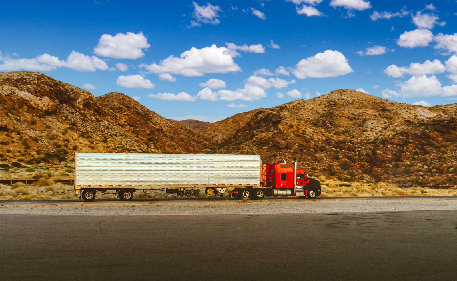 American tractor-trailer traveling on a highway